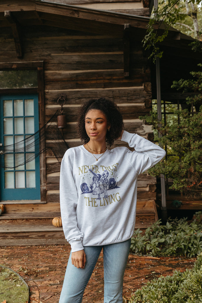 Never Trust The Living Sweatshirt - Girl Tribe Co. Spooky Szn Collection