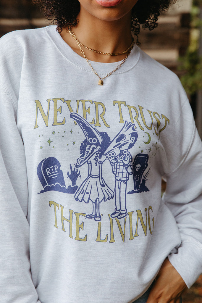 Never Trust The Living Sweatshirt - Girl Tribe Co. Spooky Szn Collection